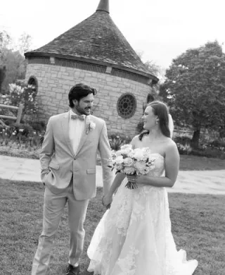 Madelyn and Andrew glance at each other and walk on their wedding day