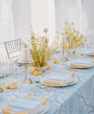 Amalfi Coast-inspired tablescape featuring bright yellow and blue hues
