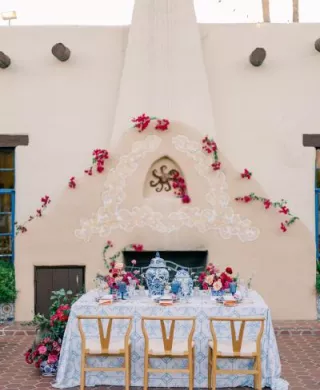 Bold and romantic reception table framed by the storied Hacienda del Sol