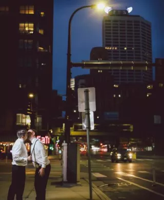 Matt and Luke embrace on the streets of Minneapolis