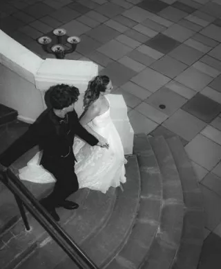 Bride and groom descend staircase at Maryhill Museum of Art