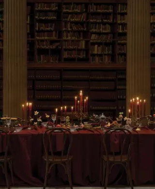 Candlelit reception table in wine hues at Avalon