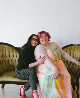 Owners of Honeybee Bridal pose for a photo 