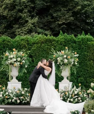 Paige and Nick seal their vows with a kiss in outdoor ceremony at Columbia Collective