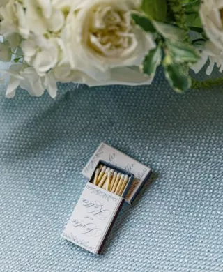 Custom matchbooks on blue tablecloth