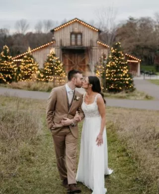 Madeline and Aaron Share a Kiss in front of Creekside Farm