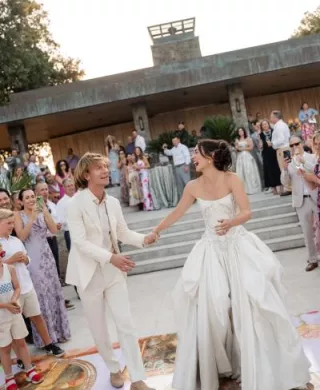 Sarina and Travis grace the custom dance floor of their Rococo-inspired wedding