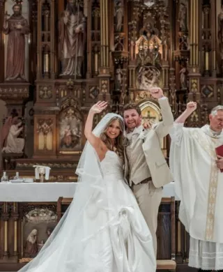 Tess and Tommy wave to their friends and family after exchanging vows 