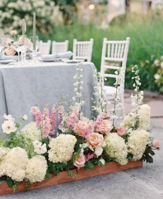 Bright florals in front of classic tablescape at Fox Hollow Farms