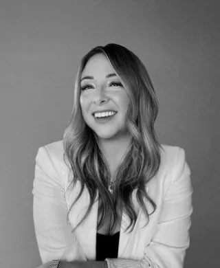 Black and white headshot of Editor in Chief Lauren Mang smiling