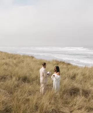 Bride and groom exchange vows in oceanside elopement
