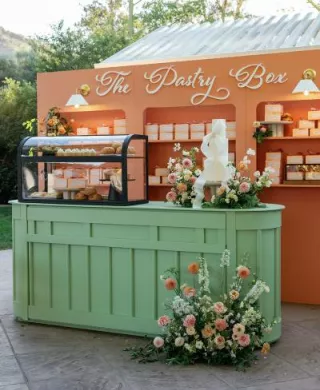 Colorful pastry box escort card display 