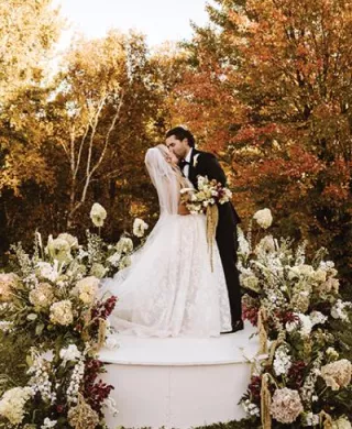 Morgan and Justin kiss at the altar in their wedding day at The Farm Wedding and Event Center