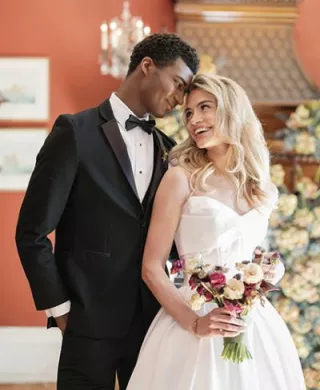 Models pose in an embrace in styled shoot at Maxwell Mansion