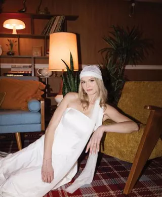 Model poses in retro-chic editorial at Graduate