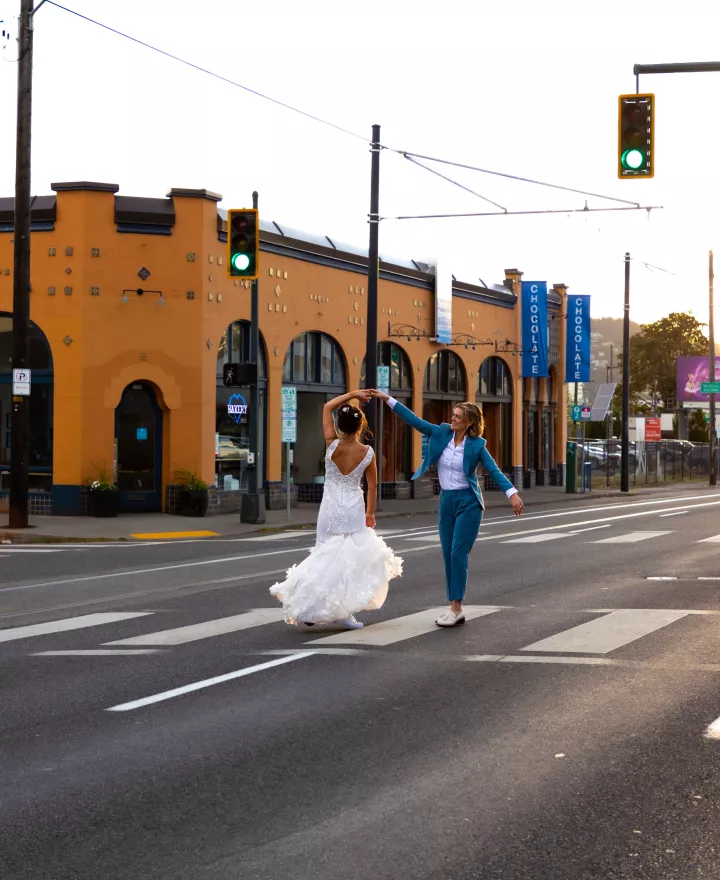 Couple dancing in the middle of the street during the golden hour of sunset