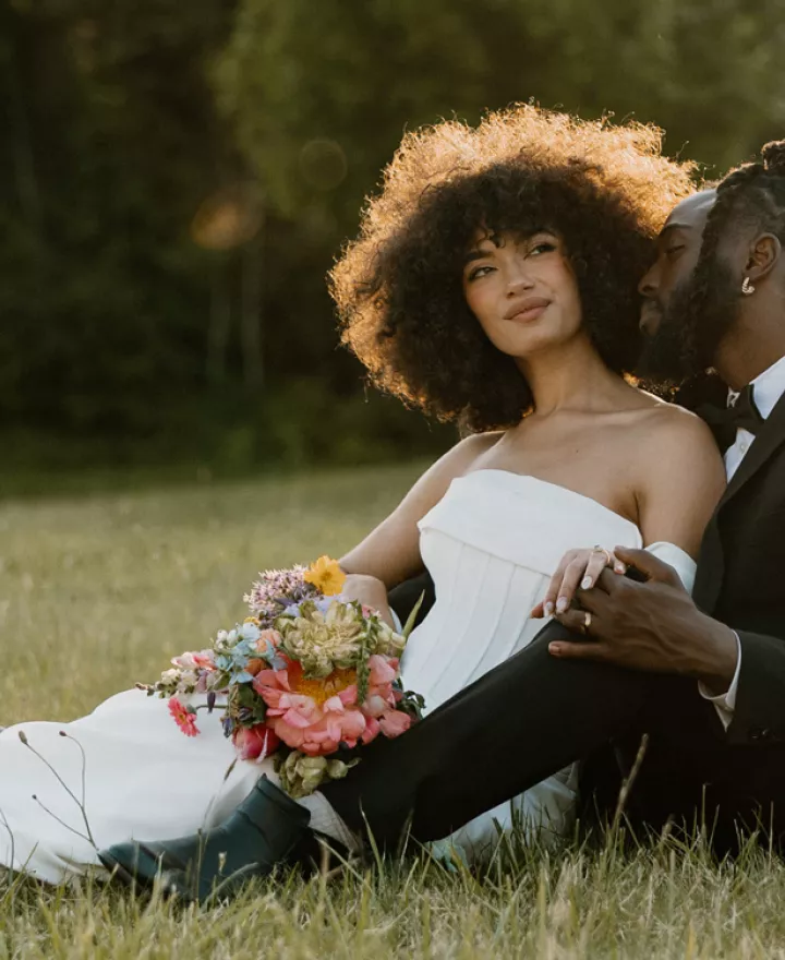 Models lounge on the golden-hour lit grounds of Wind Mountain Ranch