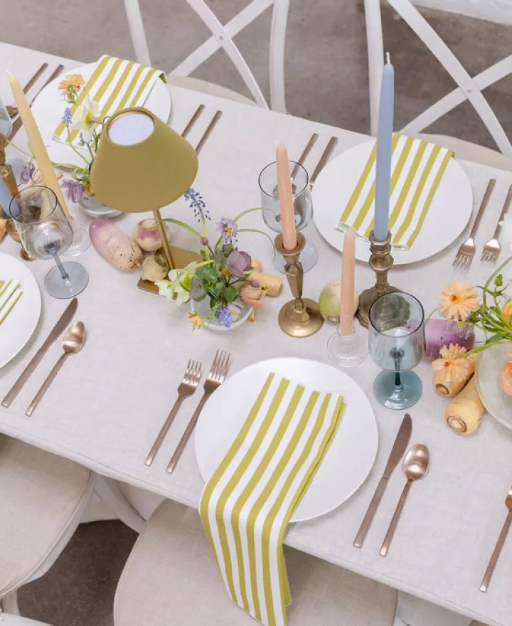 Light and airy tablescape featuring a palette of soft pastels, local blooms and vegetable details at The Whim