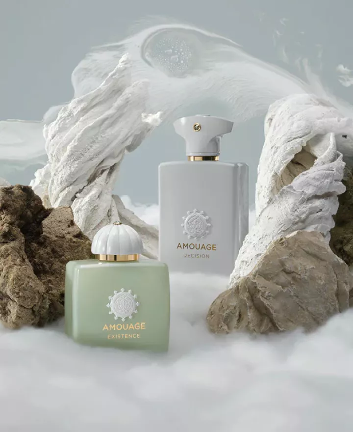 Amouage perfume promotional photo, fragrance bottle in center surrounded by clouds
