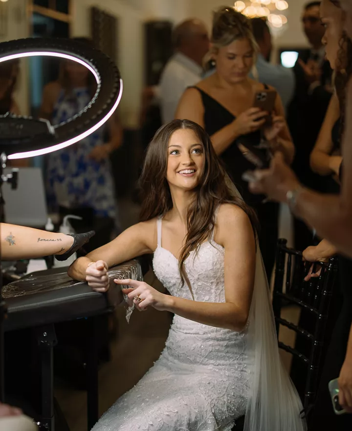 Bride receives a tattoo during her cocktail hour in wedding day at The LedgeCrest Reserve