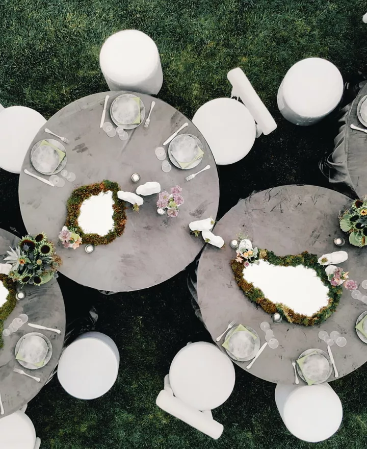 Aerial view of reception tablescape featuring storm-grey hues and mirrored details at Grand View Malibu