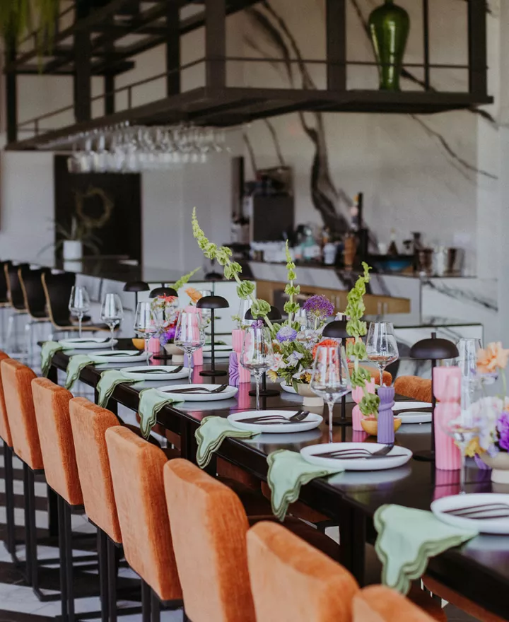 Modern and funky imagined reception scene featuring pastel hues at District Wine Bar