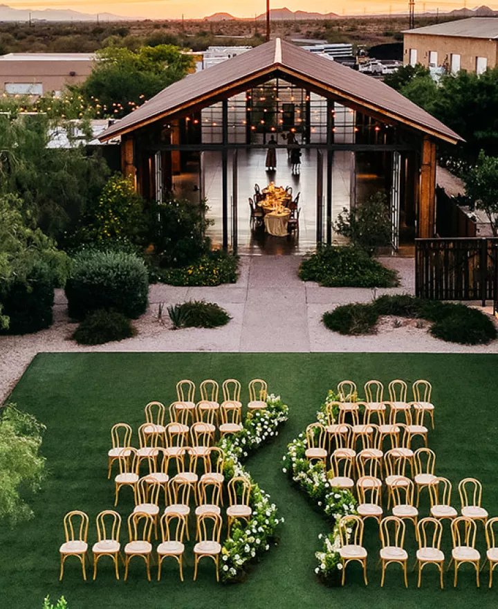Sun sets in landscape shot of the editorial outdoor ceremony space at The Paseo