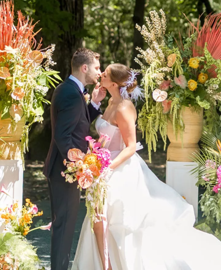 Birds of Paradise and tropical florals in lush altar space framing couple in Palm Springs-inspired editorial at Equestria West 