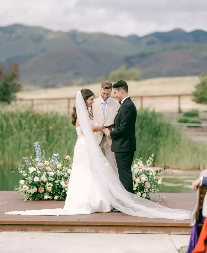 Bride and groom at the altar during their ceremony against the scenic views at Cavalli Estates