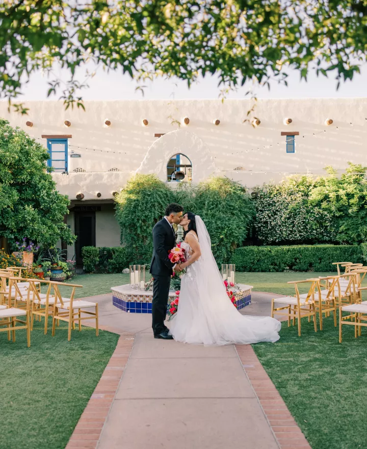 Models stand at the center of a circlular ceremony set-up in romantic editorial at Hacienda del Sol