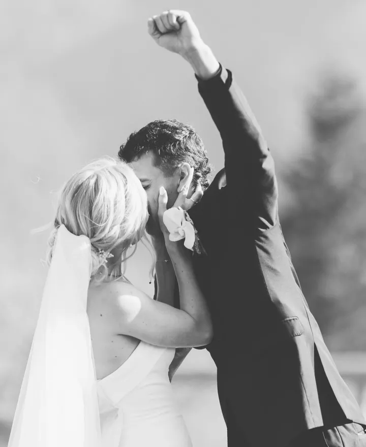 Ashley and Jaxson seal their vows with a kiss and Jaxson pumps his fist in the air 