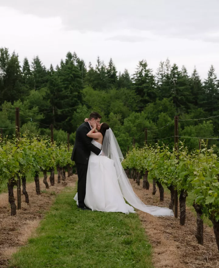 Amanda and Sam pose on the grounds of Oswego Hills Winery