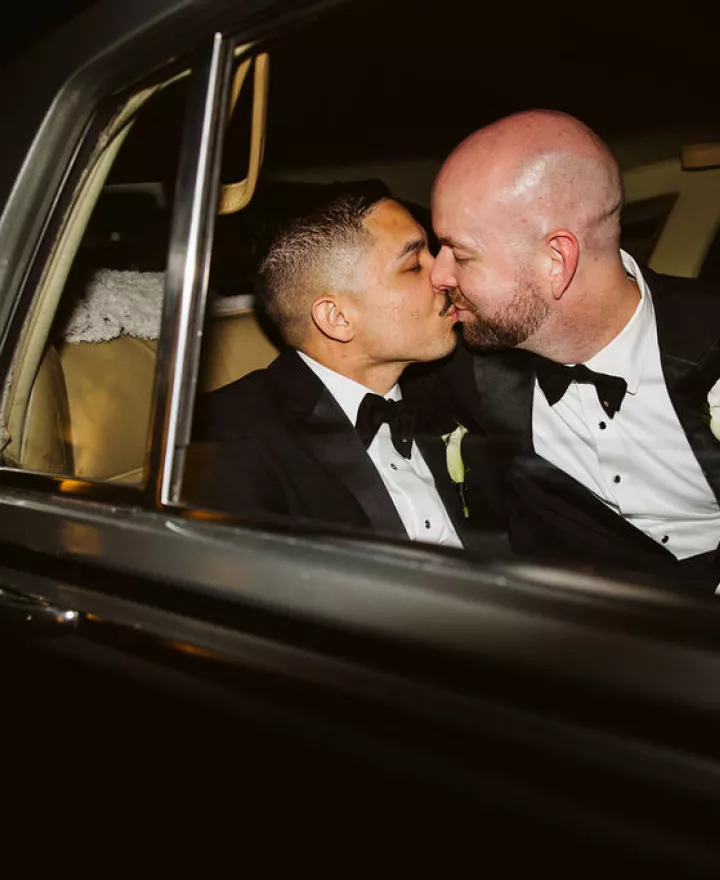 Kendall and Kyle kiss in their vintage getaway car on their wedding day