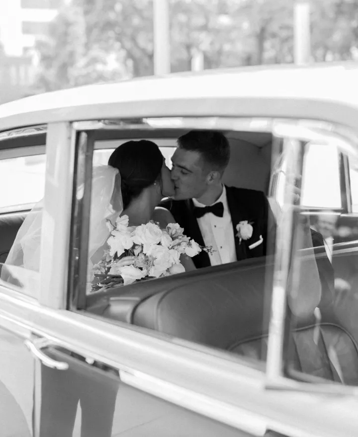 Meredith and Daniel ride off in their getaway car on their wedding day 