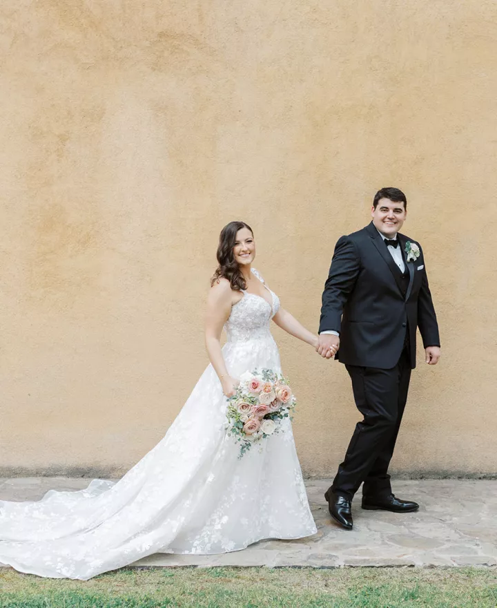 Samantha and Ryan walking the grounds of Villa del Sol d'Oro on their wedding day