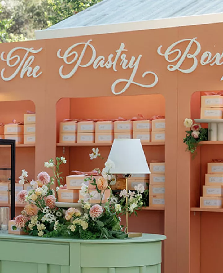 Colorful pastry box escort card display 