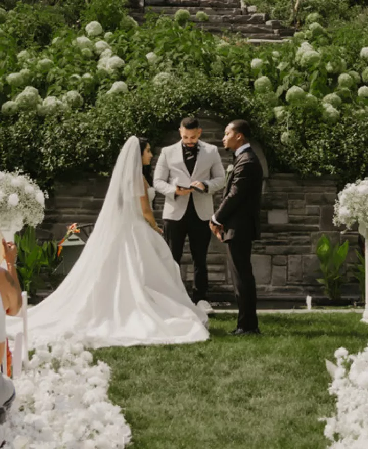 Jenny and Joseph stand at the outdoor altar during ceremony at Villa Terrace 