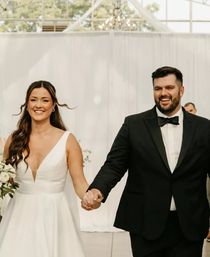 Lauren and Nathan walk back down the aisle after exchanging vows at Greenhouse No 7