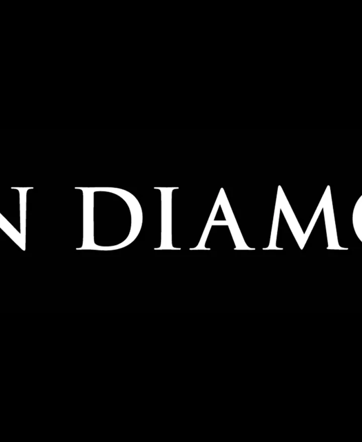 white Iron Diamond logo against black background