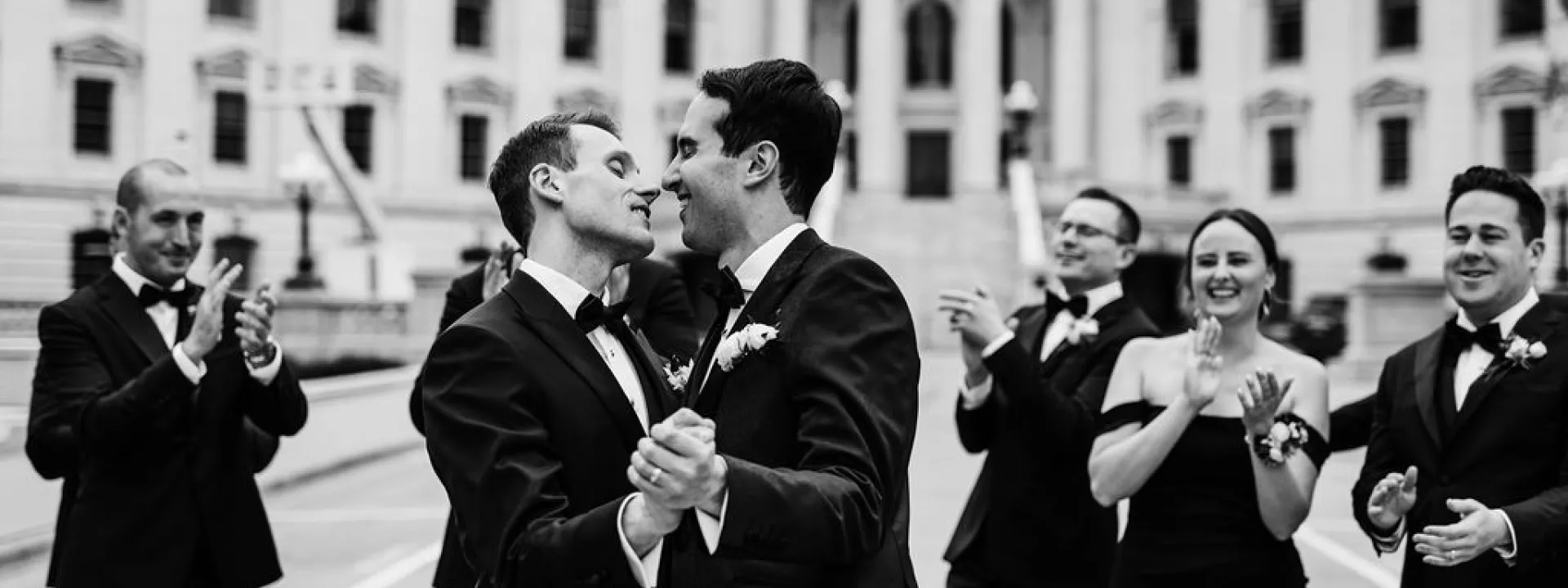 Zach and Clay Celebrating with their Wedding Party in Madison, Wisconsin