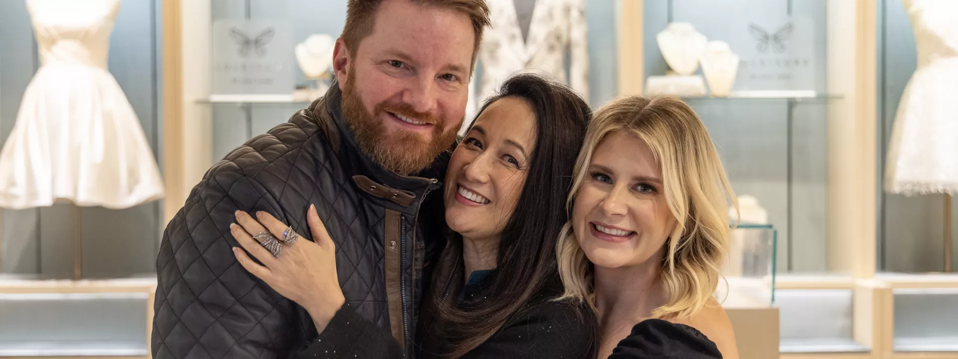 Dan Riggs, Sonja Babich and Luly Yang embracing