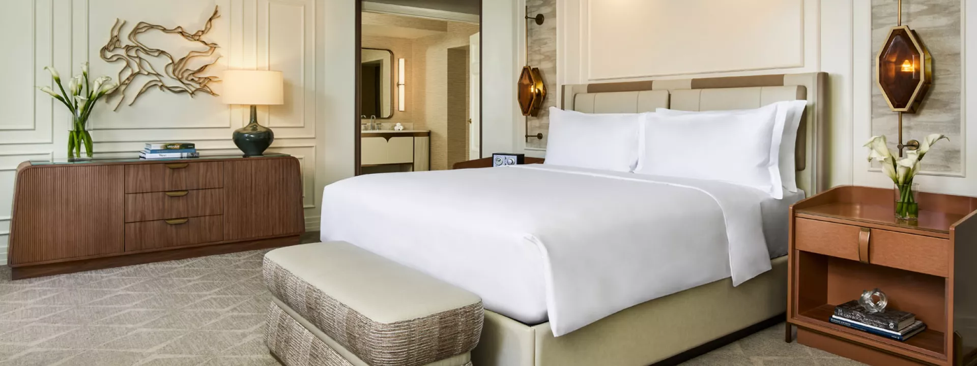 Explore the epitome of luxury in the Ritz-Carlton, Denver's Presidential Suite, featuring a plush king bed, elegant furnishings, and refined decor, perfect for a sophisticated stay in the heart of the city