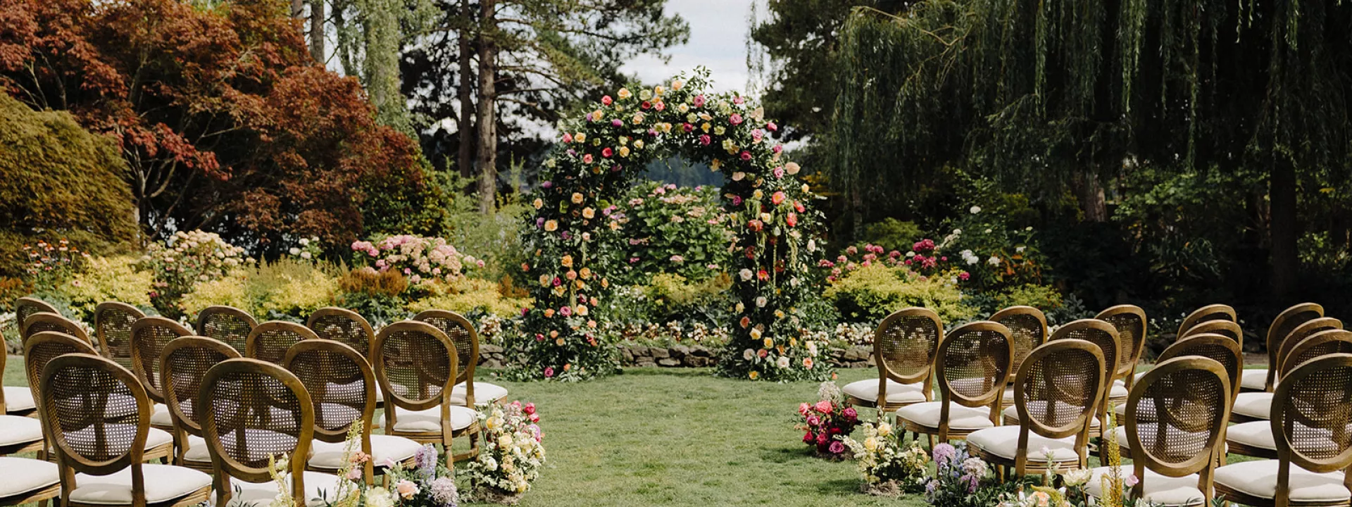 Lush floral-forward ceremony scene at Kiana Lodge