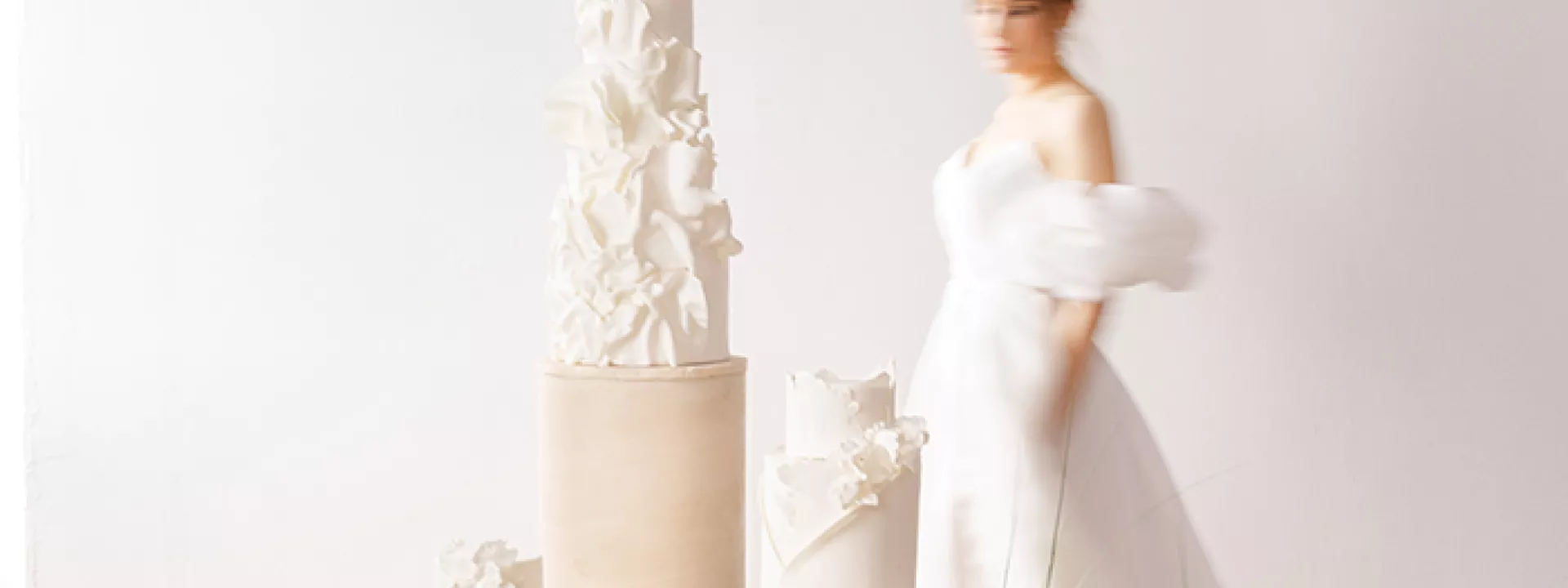 Chic and Elegant Wedding Cakes Displayed Amongst Fresh Florals