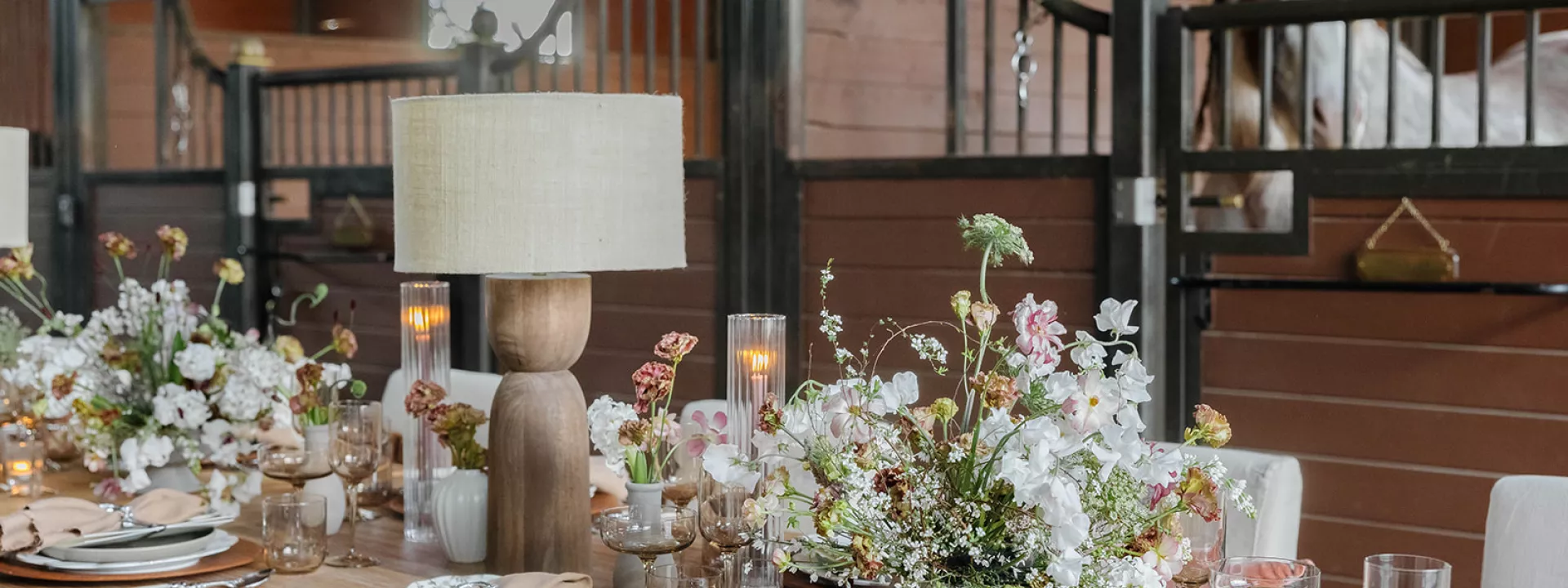 Earthy tablescape in the midst of a horse barn at TERI campus of life