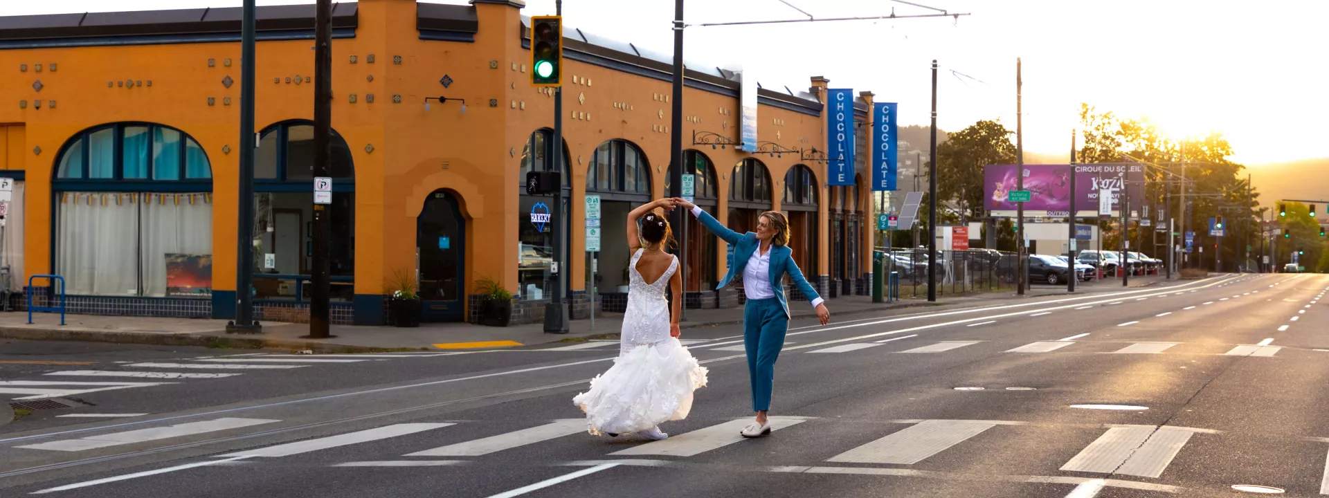 Couple dancing in the middle of the street during the golden hour of sunset