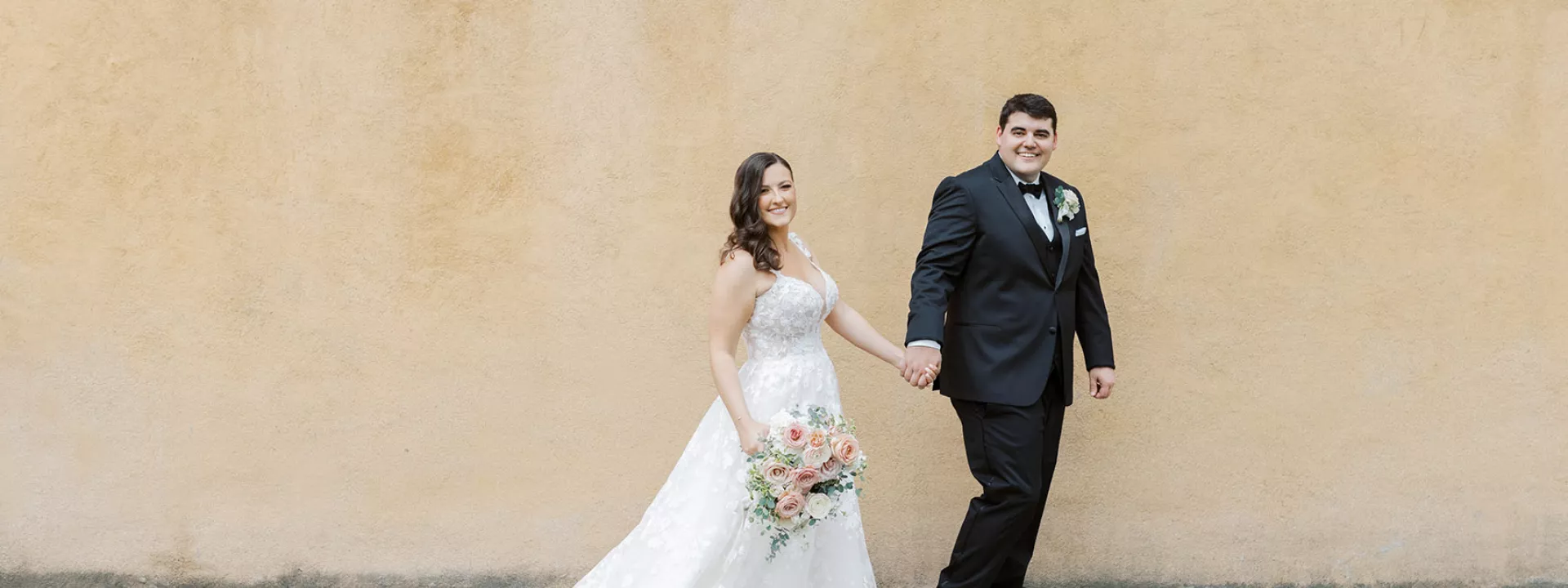 Samantha and Ryan walking the grounds of Villa del Sol d'Oro on their wedding day
