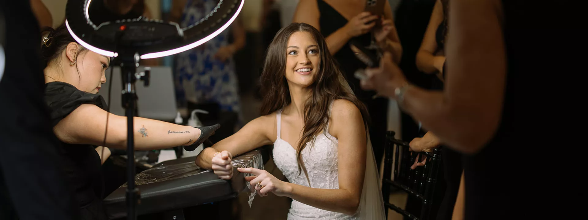 Bride receives a tattoo during her cocktail hour in wedding day at The LedgeCrest Reserve