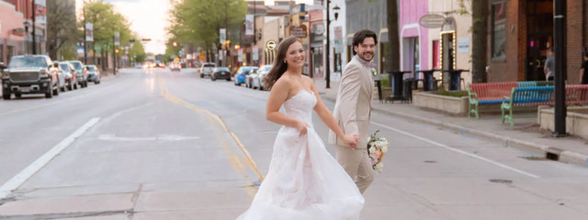 Madelyn and Andrew cross the street outside of Gather on Broadway
