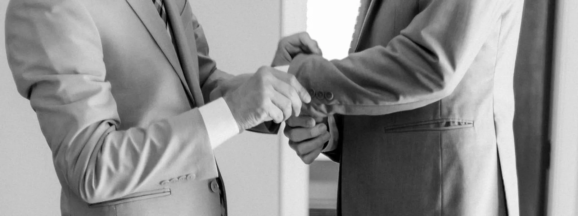 Jonathan and Robbie help each other dress for their wedding day 